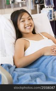 Young Girl Smiling,Lying In Hospital Bed