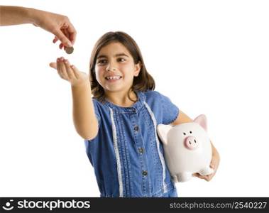 Young girl start her savings on a piggybank