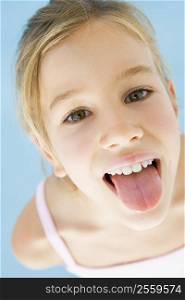 Young girl sticking her tongue out