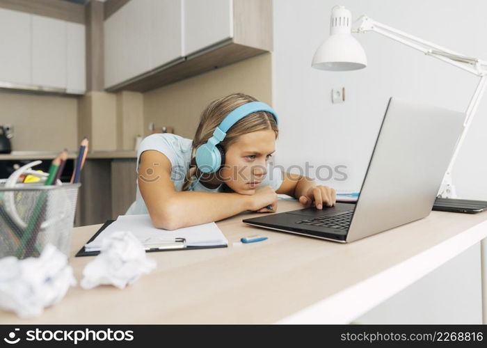 young girl studying home