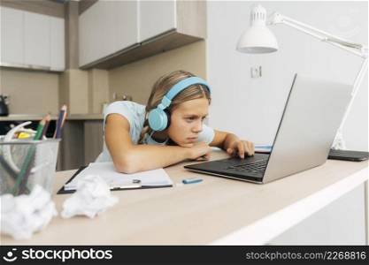 young girl studying home
