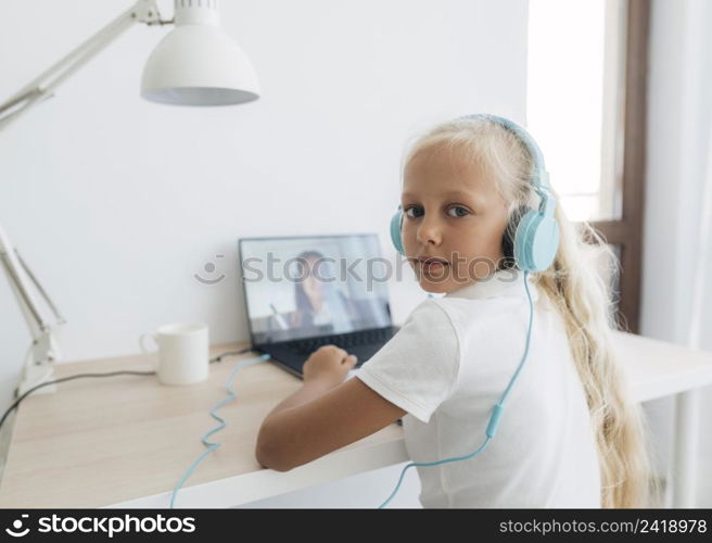 young girl studying online