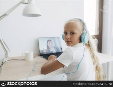 young girl studying online