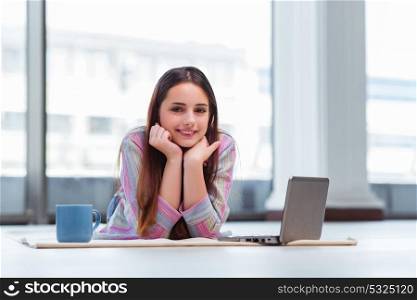 Young girl surfing internet on laptop