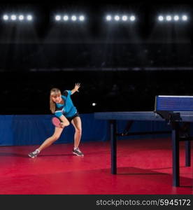 Young girl table tennis player at sports hall