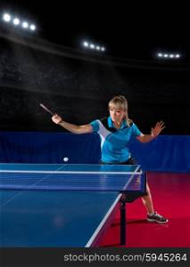 Young girl table tennis player at sports hall