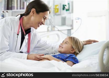 Young Girl Talking To Female Doctor In Intensive Care Unit