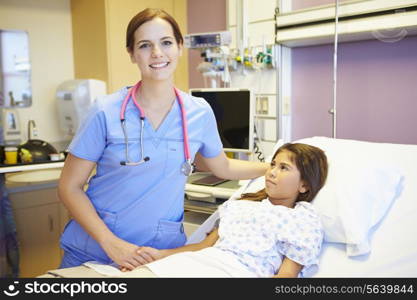 Young Girl Talking To Female Nurse In Hospital Room