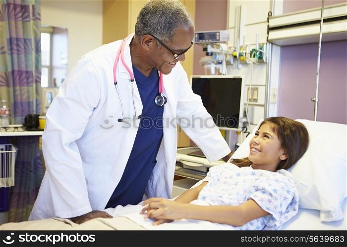 Young Girl Talking To Male Doctor In Hospital Room