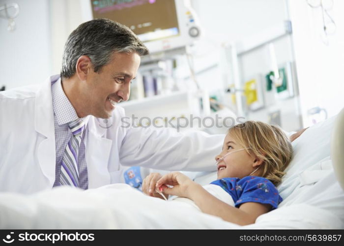 Young Girl Talking To Male Doctor In Intensive Care Unit