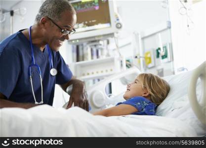 Young Girl Talking To Male Nurse In Intensive Care Unit