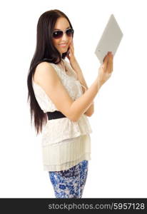 Young girl talks by tablet PC isolated