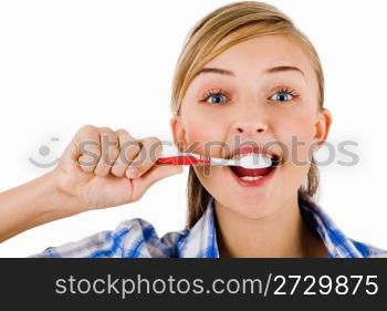 Young girl the brush her tooth on a white background