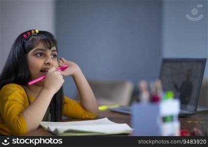 Young girl thinking about her work while attending virtual class
