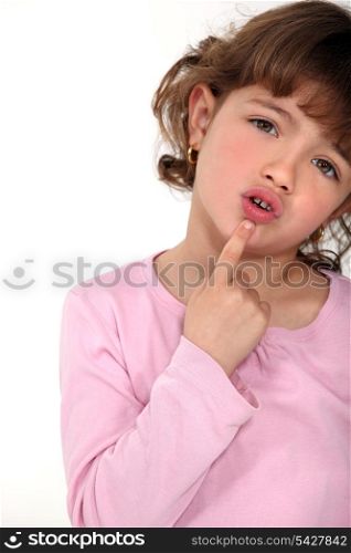 Young girl touching her chin