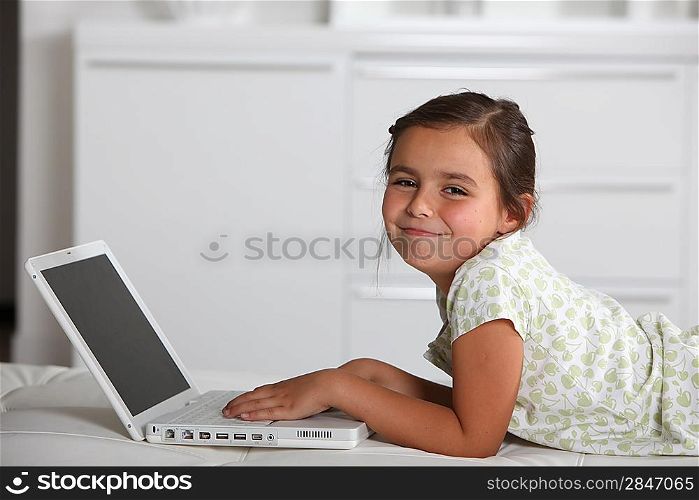 Young girl using a laptop computer