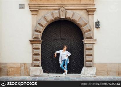 young girl walking on the old streets poland of europe