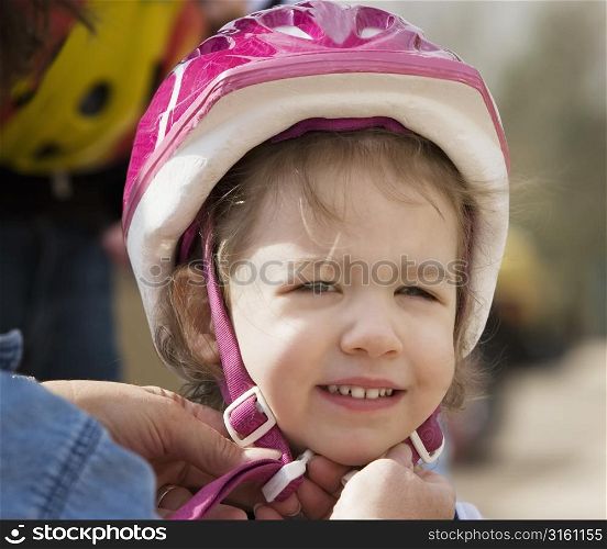 Young girl wearing a helmet