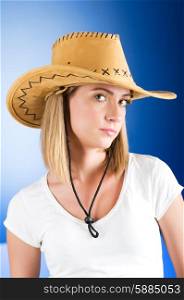 Young girl wearing cowboy hat in the studio