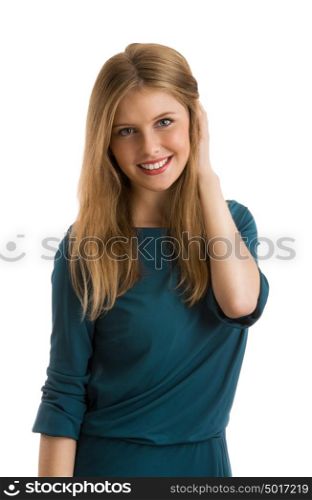 Young girl wearing elegant dress posing against white background. Hesitating