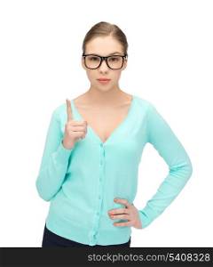 young girl wearing eyeglasses showing warning gesture