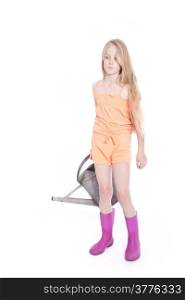 young girl wearing pink in studio with watering can
