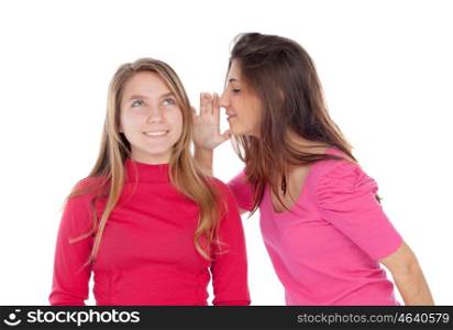 Young girl whispering a secret to her sister isolated on a white background