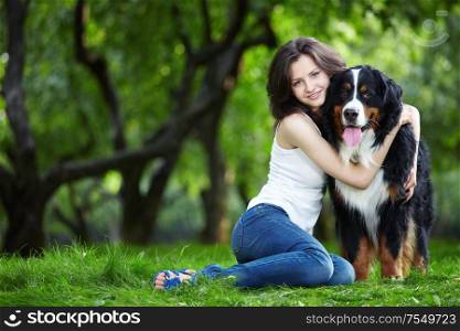 Young girl with a dog in the park