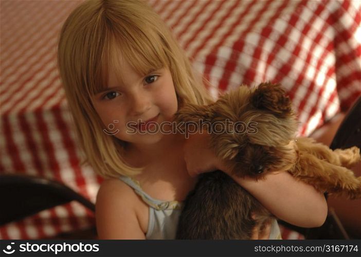 Young girl with a puppy.
