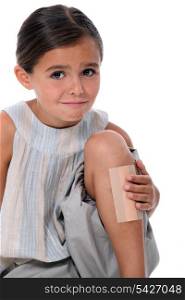 Young girl with an enormous plaster on her leg