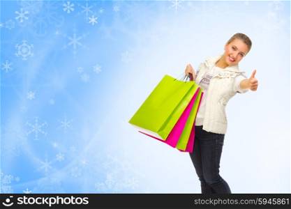 Young girl with bags on winter background