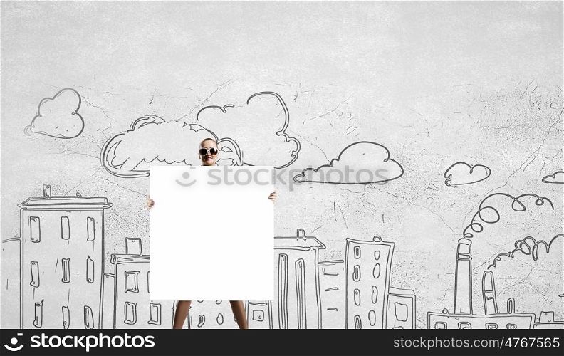 Young girl with banner. Young woman showing banner and urban sketches at background