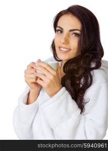 Young girl with bathrobe and cup isolated