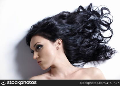 Young girl with beautiful hair on a white background