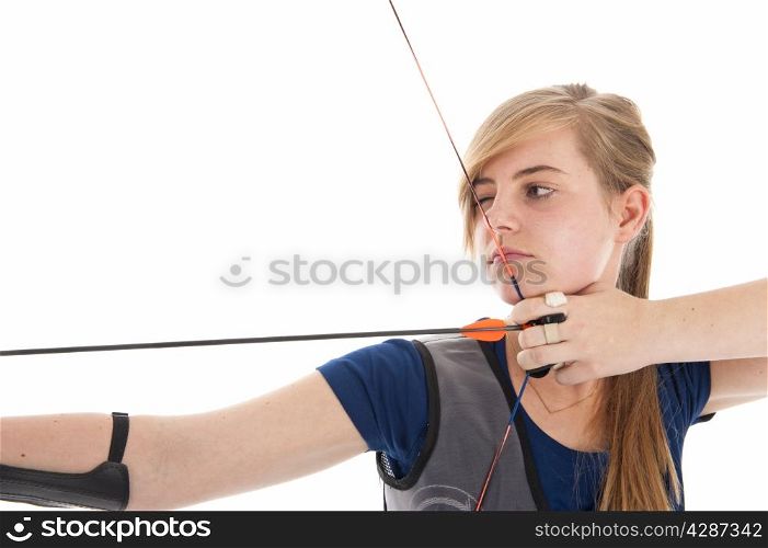 Young girl with blue shirt aiming with a longbow in closeup