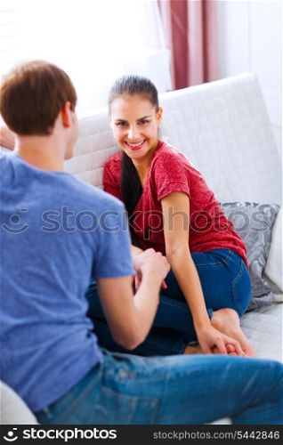 Young girl with boyfriend relaxing at home&#xA;