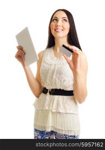 Young girl with credit card and tablet PC isolated