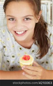 Young girl with cupcake
