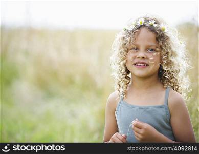 Young girl with daisies in hair