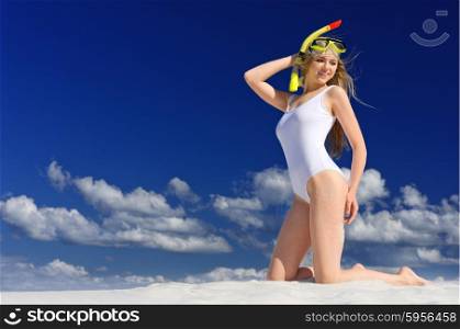 Young girl with diving mask on the beach