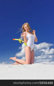 Young girl with diving mask on the beach