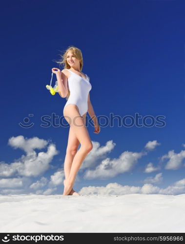 Young girl with diving mask on the beach