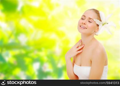 Young girl with flower on spring floral background