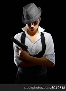 Young girl with gun and hat