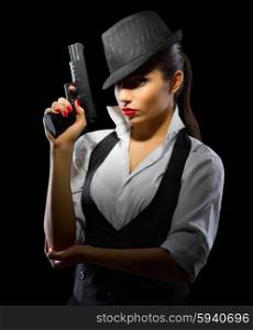 Young girl with gun on black