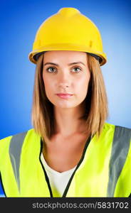 Young girl with hard hat against background