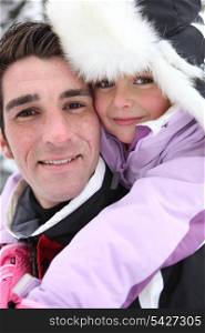 Young girl with her father on a winter&rsquo;s day
