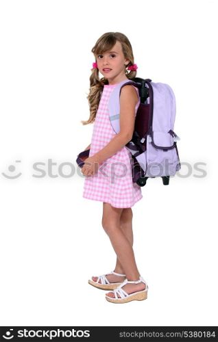 Young girl with her schoolbag