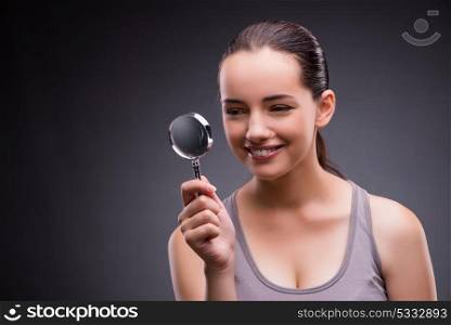 Young girl with magnifying glass