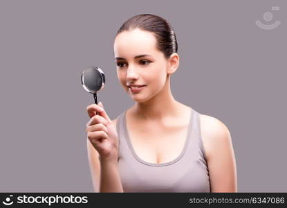 Young girl with magnifying glass